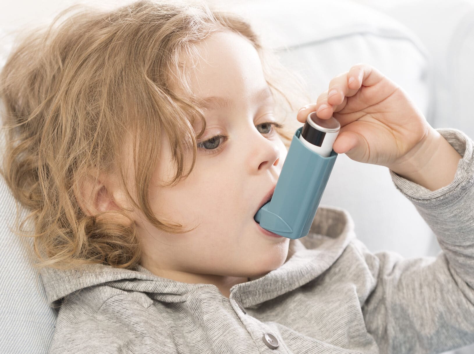 Small child using an inhaler